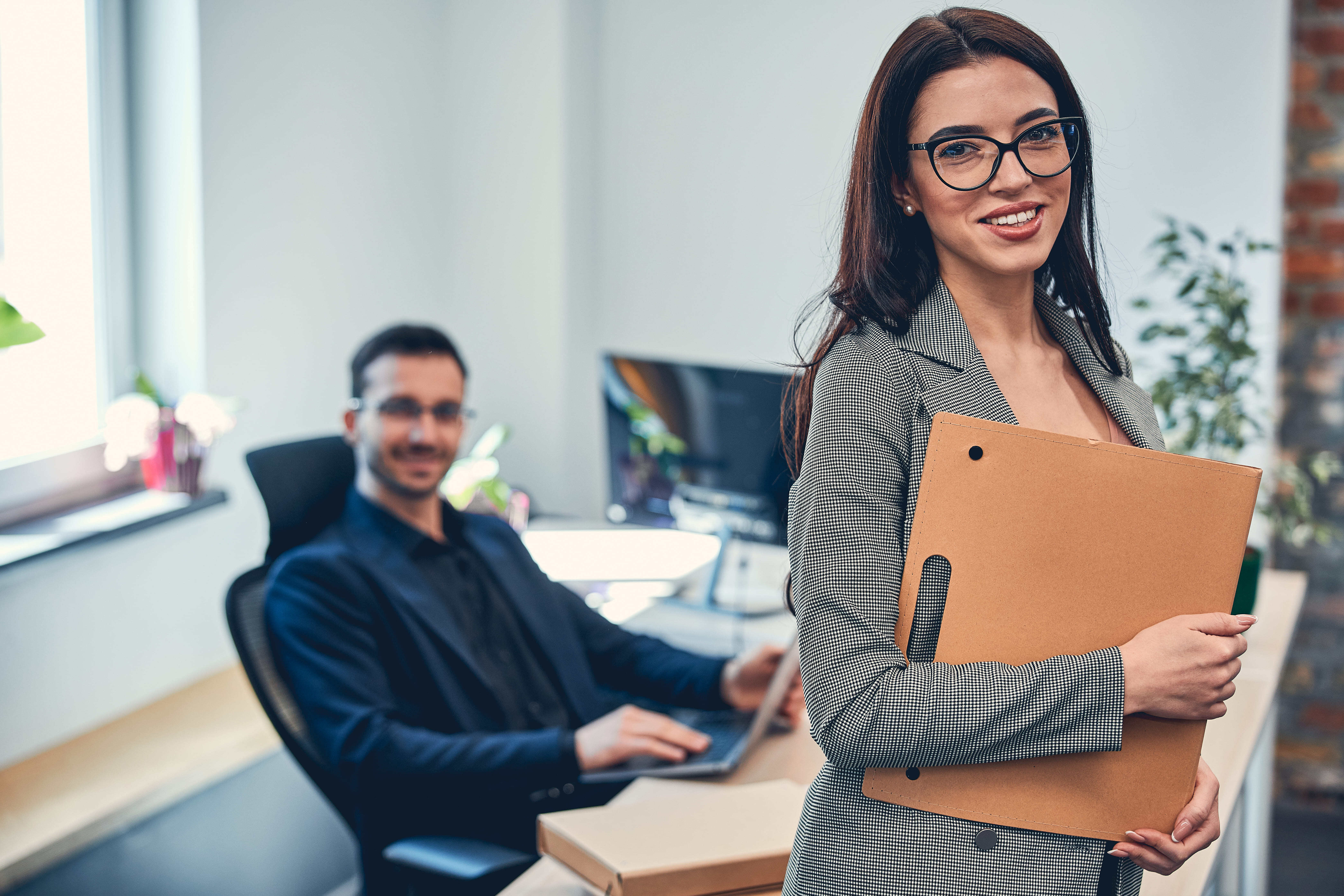 smiling-attractive-woman-wearing-glasses-holding-f-2023-11-27-05-35-07-utc (1)